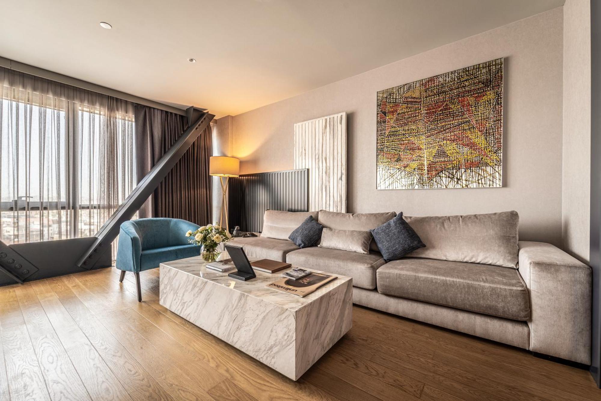 Sofitel Istanbul Taksim Hotel Bagian luar foto A living room in a penthouse apartment
